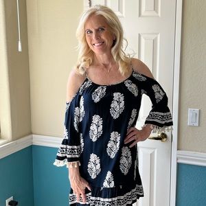 Navy and tan boutique dress with cold shoulders and Pom poms! Size S